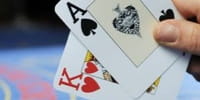 The picture shows a winning hand in blackjack: Heart King + Ace of Spades.